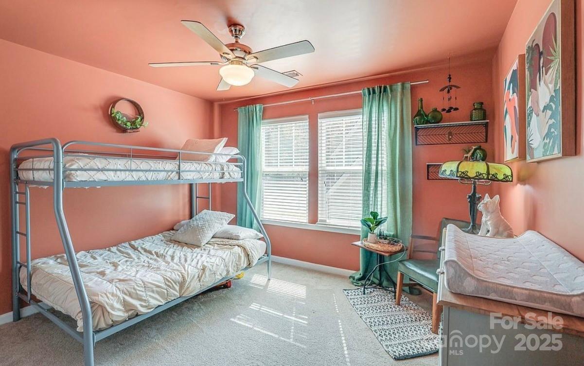 411 Stonefield Circle Moncks Corner, SC 29461 - Photo 29 of 42 a bedroom with a bed couch and a large window
