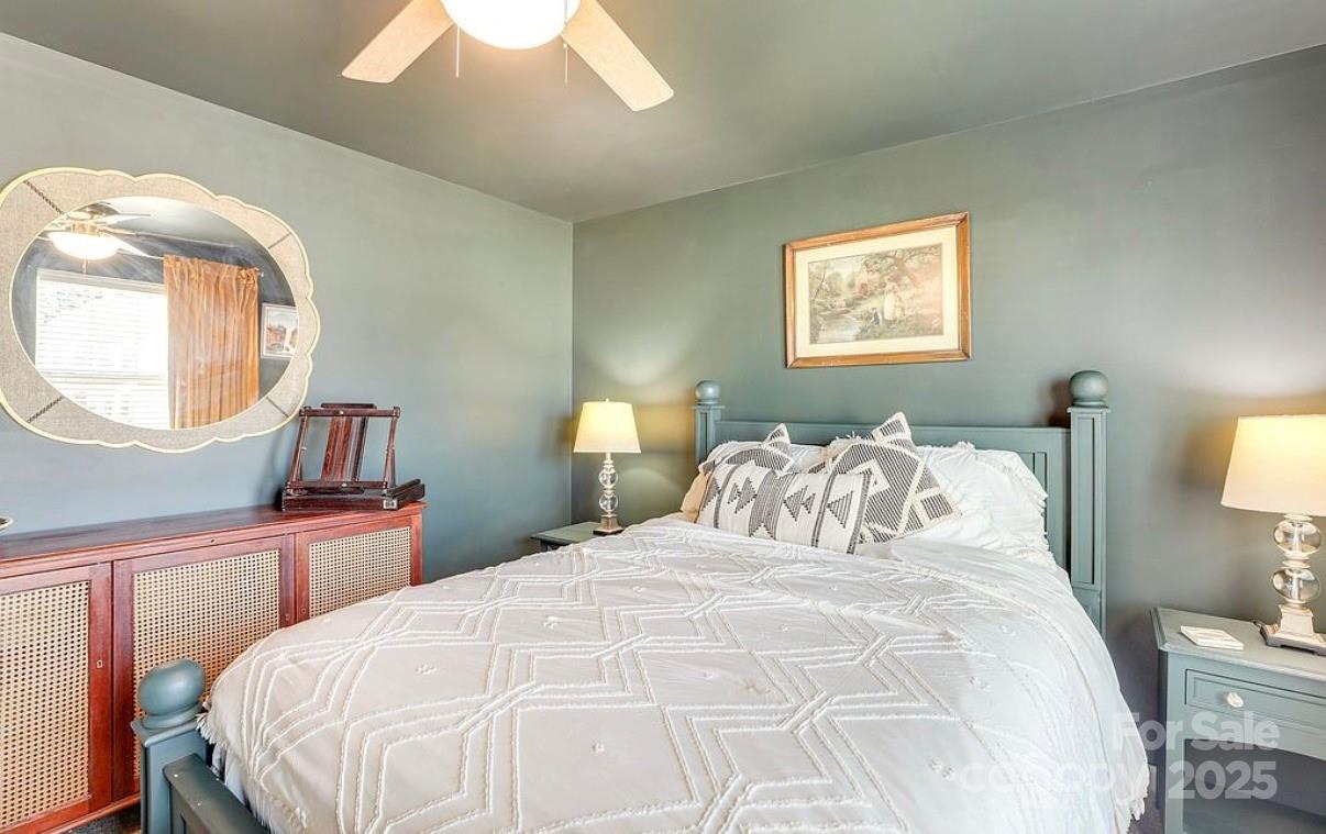 411 Stonefield Circle Moncks Corner, SC 29461 - Photo 34 of 42 a bedroom with a bed and a mirror