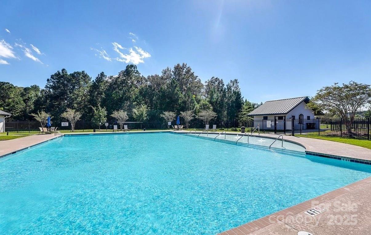 411 Stonefield Circle Moncks Corner, SC 29461 - Photo 41 of 42 a swimming pool with outdoor seating and yard