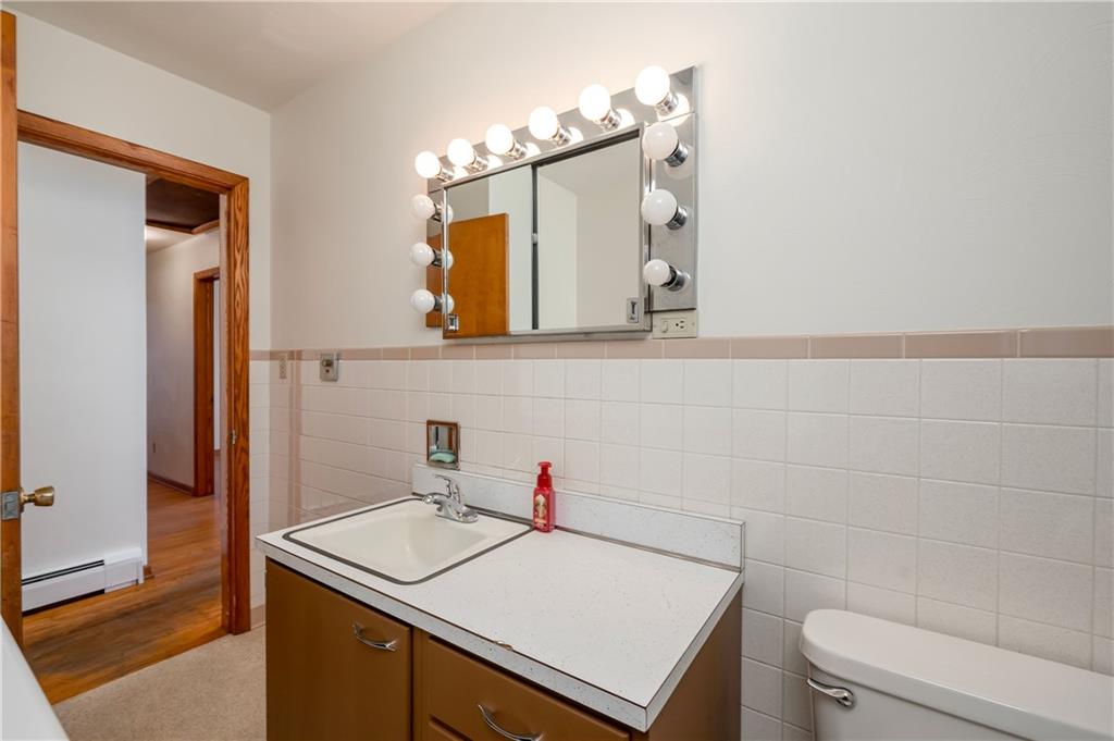 147 Grindel Road Prospect, PA 16052 - Photo 9 of 25 a bathroom with a sink toilet and mirror