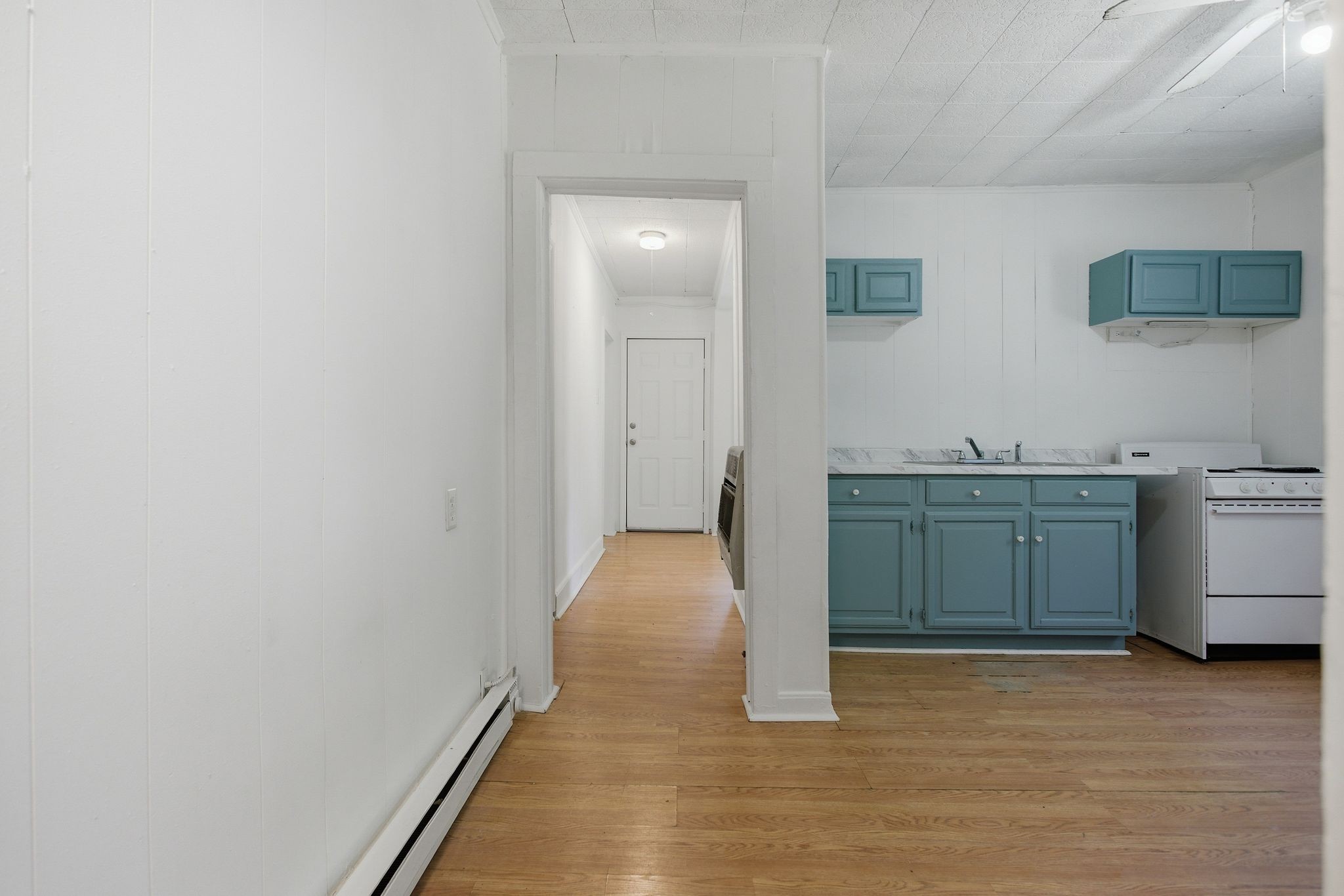 433 Jones Street Pulaski, TN 38478 - Photo 21 of 25 a view of a kitchen with white cabinets