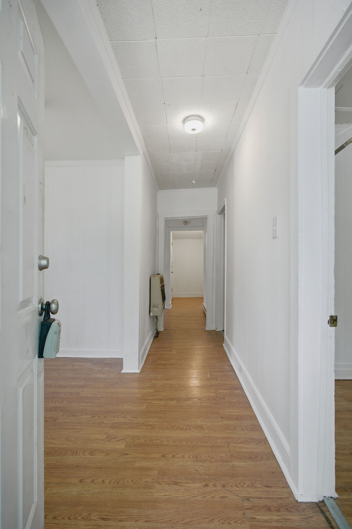 433 Jones Street Pulaski, TN 38478 - Photo 7 of 25 a view of a hallway with wooden floor