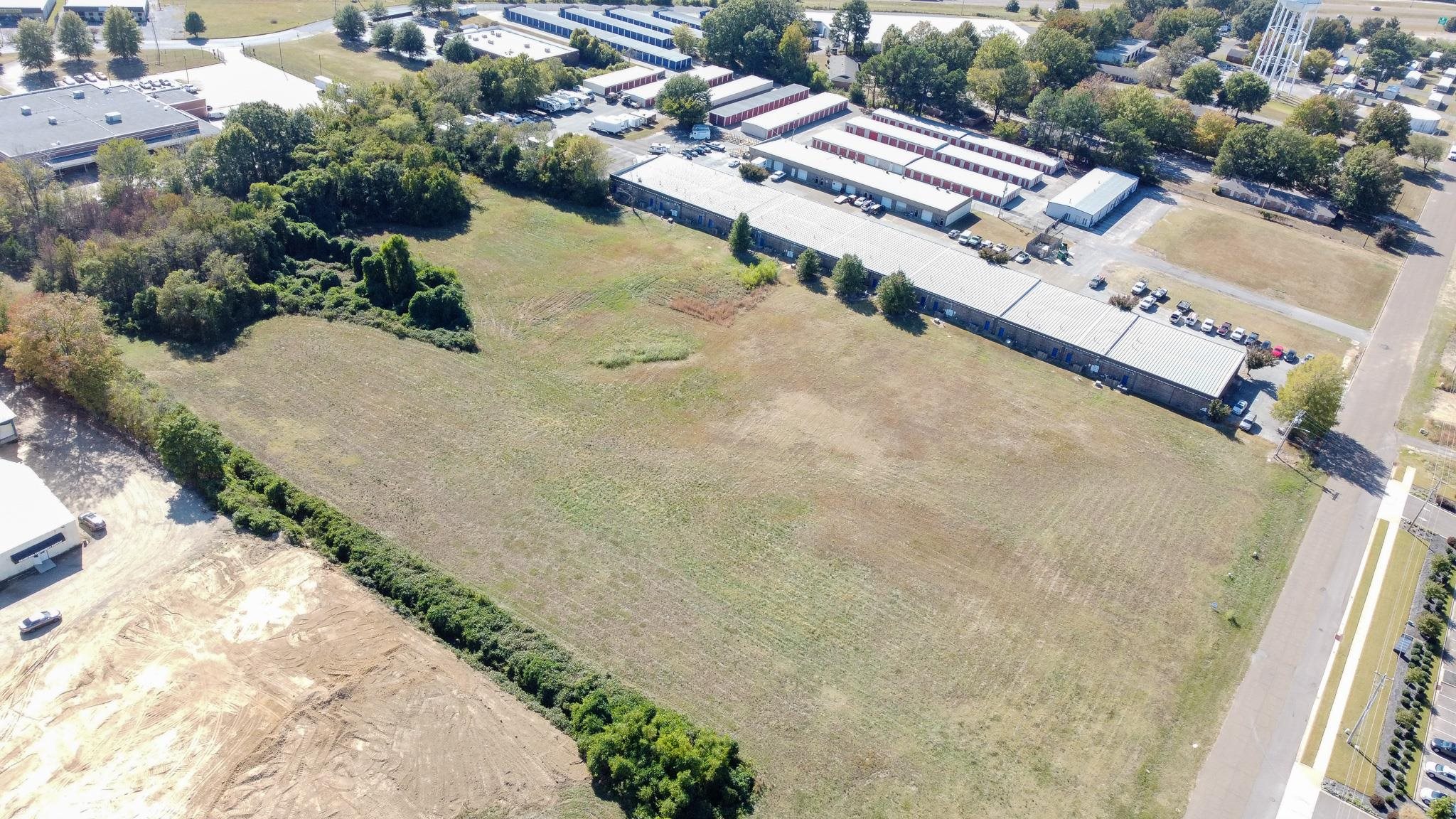 0 Caroma Street Olive Branch, MS 38654 - Photo 8 of 8 an aerial view of a house with a yard and lake view