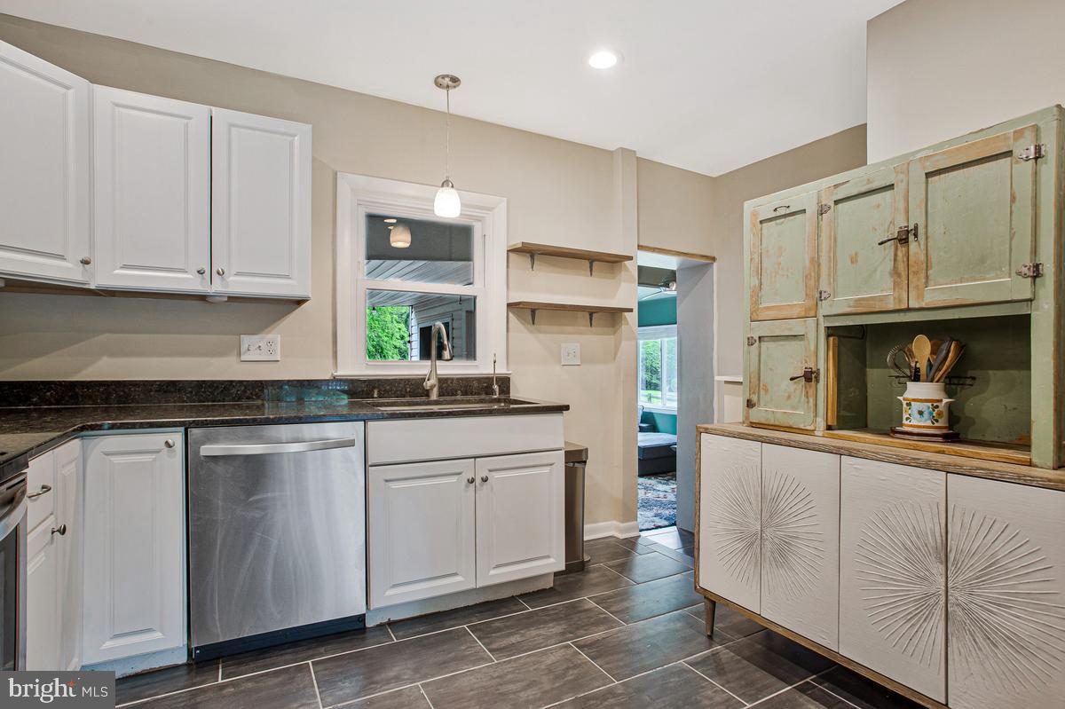 976 Shore Acres Road Arnold, MD 21012 - Photo 17 of 40 a kitchen with stainless steel appliances granite countertop a sink and cabinets