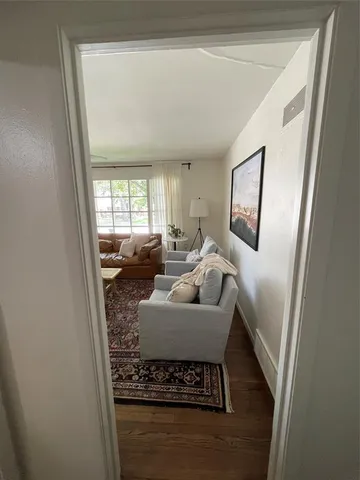 a living room with furniture and a rug