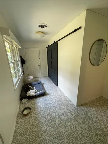 a room with furniture and a window