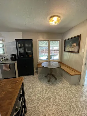 a living room with dining table