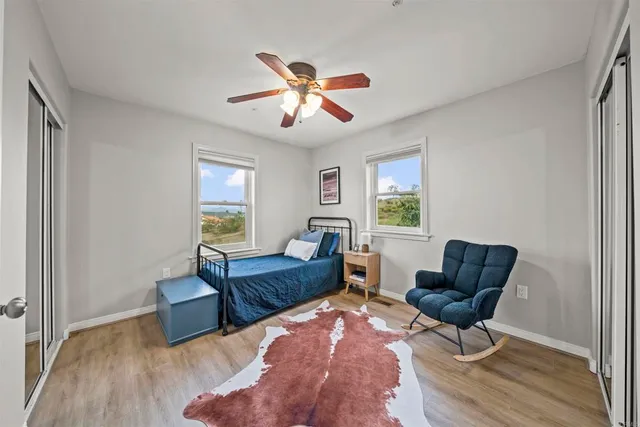a backyard of a house with table and chairs