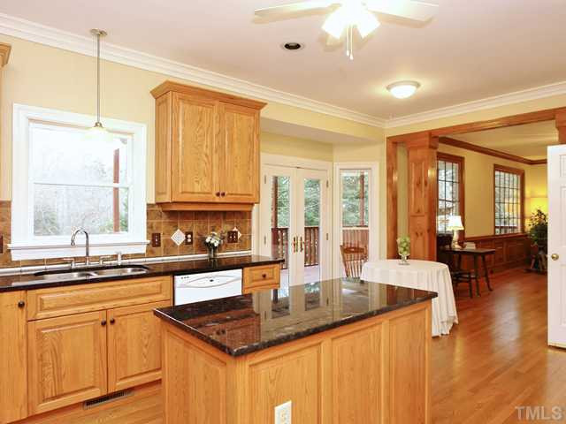 1605 Chatsworth Lane Raleigh, NC 27614 - Photo 1 of 25 Updated kitchen right off the dining room with center island, oak cabinetry, granite counter tops and beautiful tile backsplash! Kitchen
