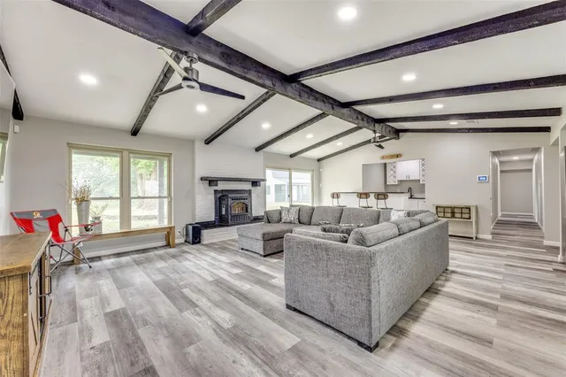 a kitchen with granite countertop a sink a counter space stainless steel appliances and cabinets