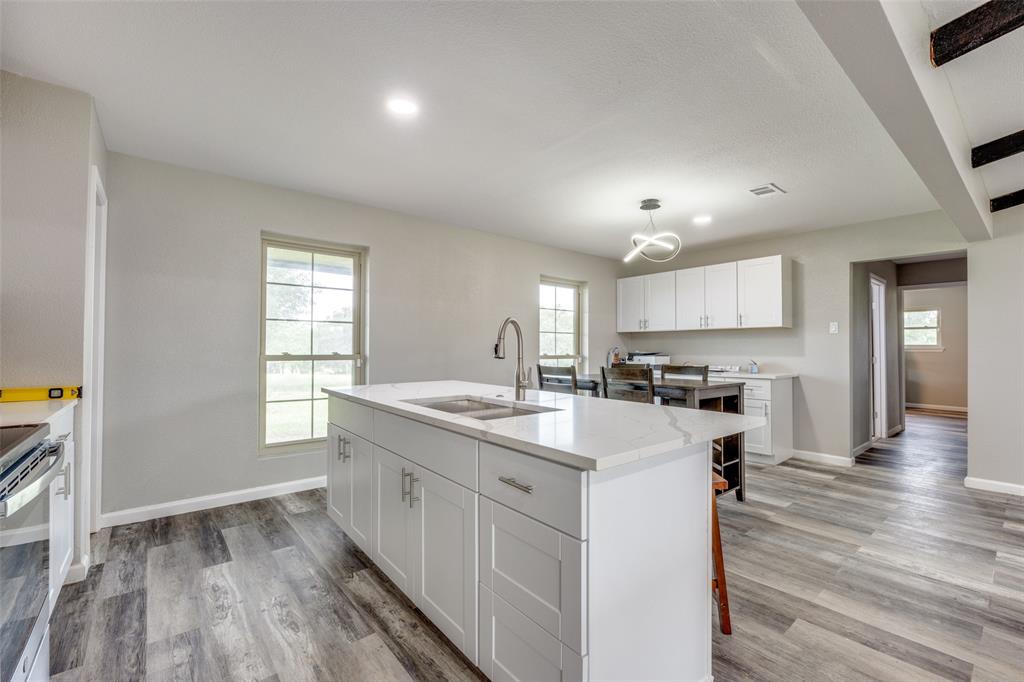 738 Campground Road Sherman, TX 75090 - Photo 20 of 40 a kitchen with a sink stove and cabinets