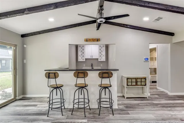 a kitchen with granite countertop a sink and a window