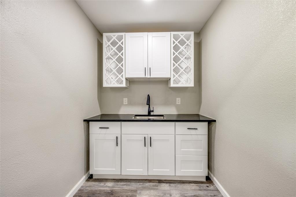 738 Campground Road Sherman, TX 75090 - Photo 23 of 40 a kitchen with granite countertop a sink and a window
