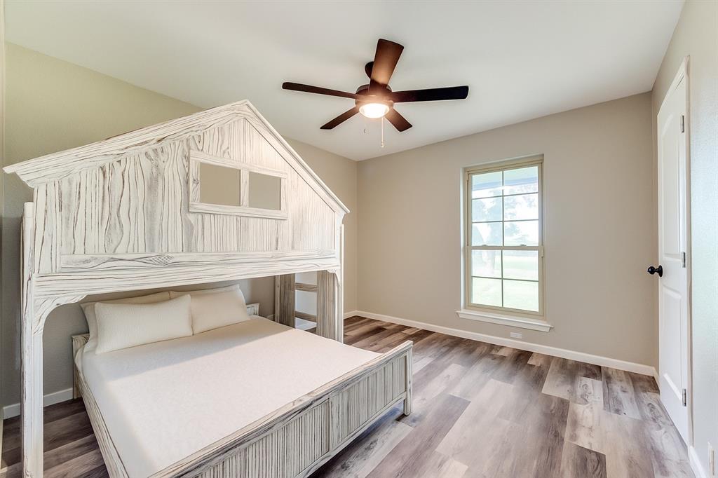 738 Campground Road Sherman, TX 75090 - Photo 27 of 40 a bedroom with a bed and a window