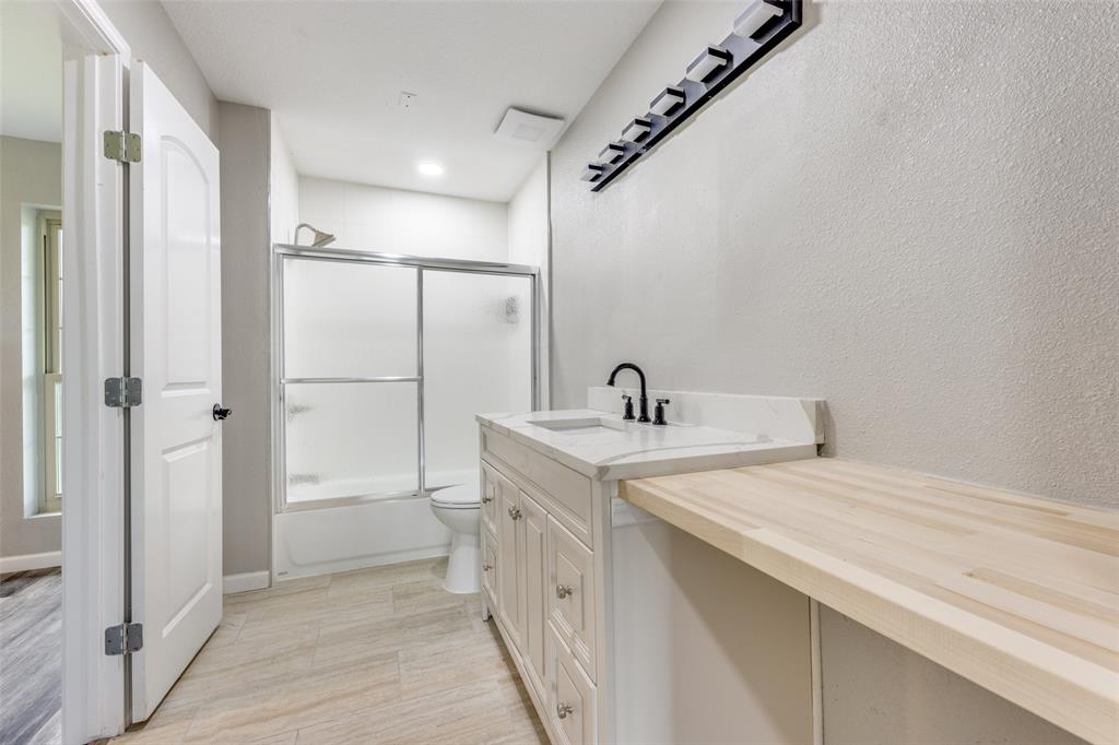 738 Campground Road Sherman, TX 75090 - Photo 29 of 40 a spacious bathroom with a double vanity sink a mirror and shower