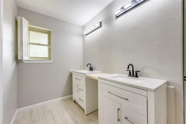 a bedroom with a bed and a ceiling fan