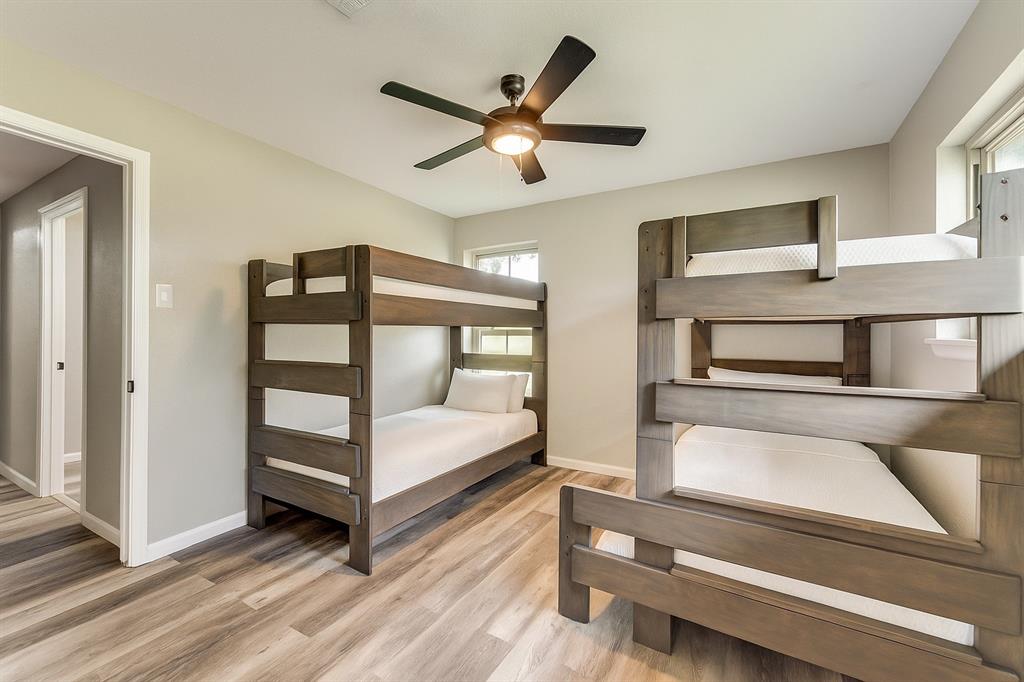 738 Campground Road Sherman, TX 75090 - Photo 33 of 40 a bedroom with a bed and a ceiling fan