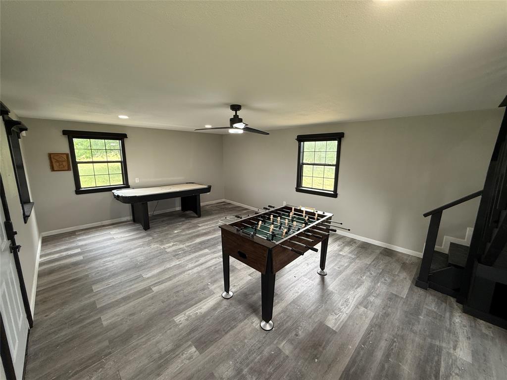 738 Campground Road Sherman, TX 75090 - Photo 36 of 40 a living room with furniture and a wooden floor