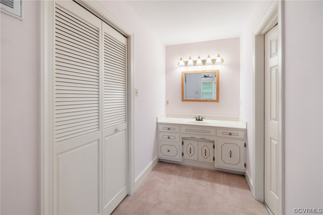 11100 Golden Leaf Road Chester, VA 23831 - Photo 11 of 39 a bathroom with a sink and a mirror