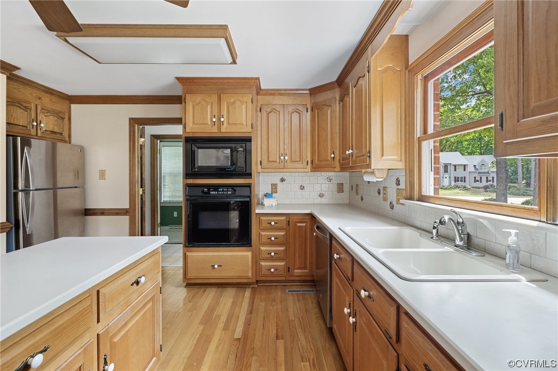 11100 Golden Leaf Road Chester, VA 23831 - Photo 16 of 39 a kitchen with a sink stove and refrigerator
