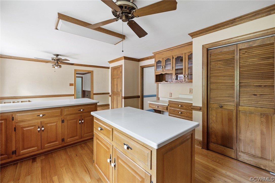 11100 Golden Leaf Road Chester, VA 23831 - Photo 17 of 39 a kitchen with a stove a sink a refrigerator cabinets and wooden floor