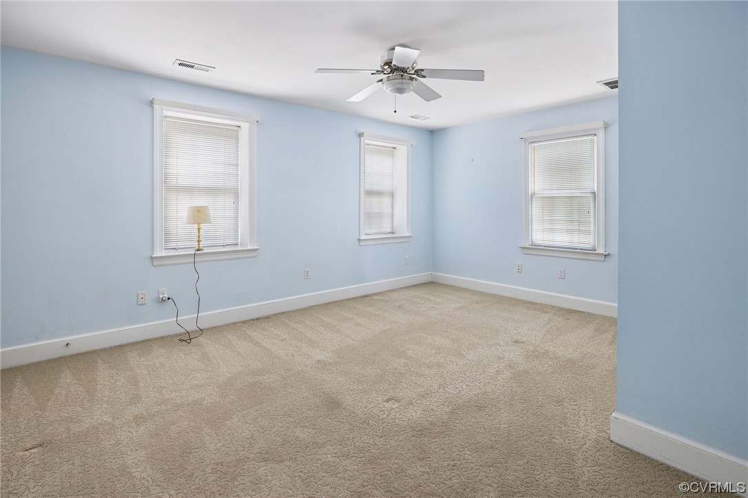 11100 Golden Leaf Road Chester, VA 23831 - Photo 26 of 39 an empty room with windows and fan