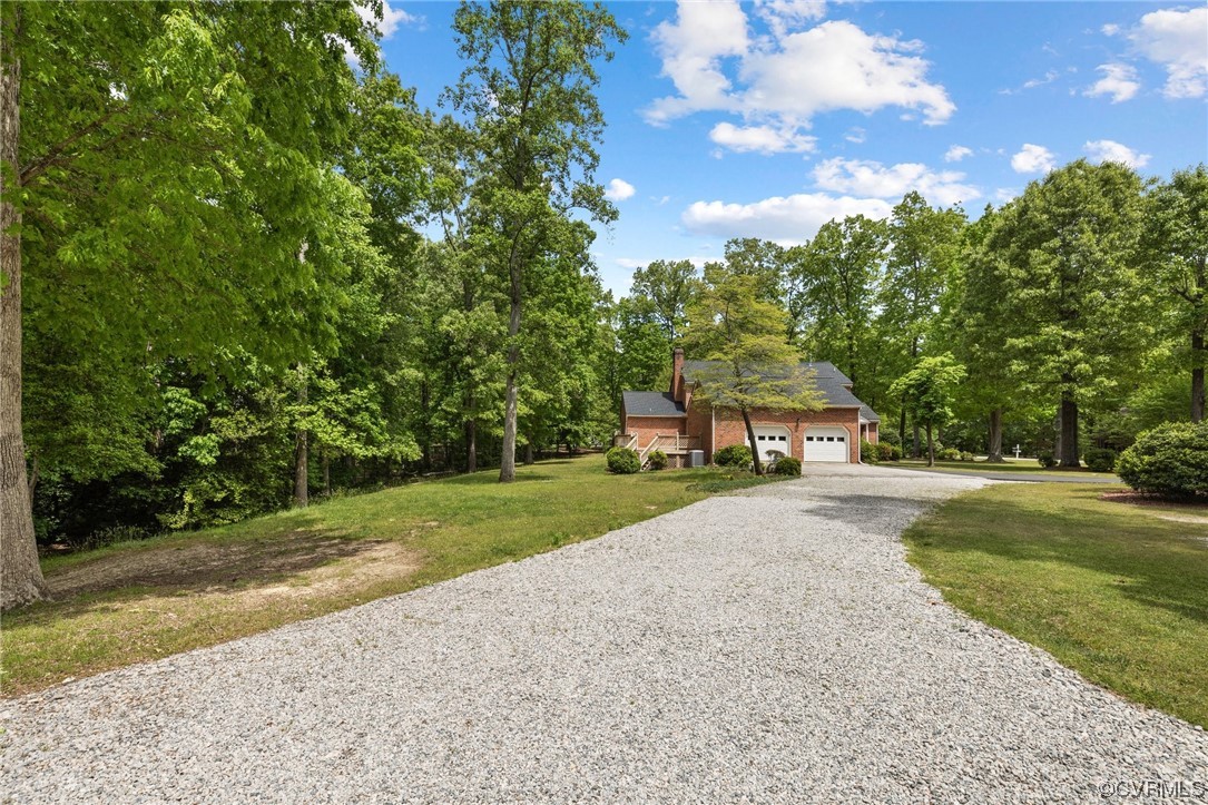 11100 Golden Leaf Road Chester, VA 23831 - Photo 35 of 39 a front view of a house with a yard and trees