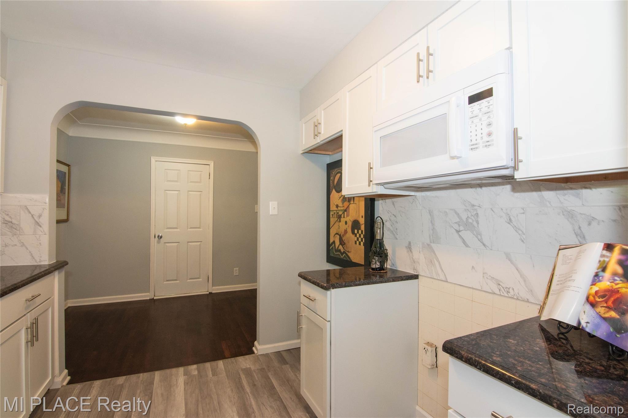 22330 Berg Road Southfield, MI 48033 - Photo 19 of 32 New cabinets and vinyl flooring in the kitchen