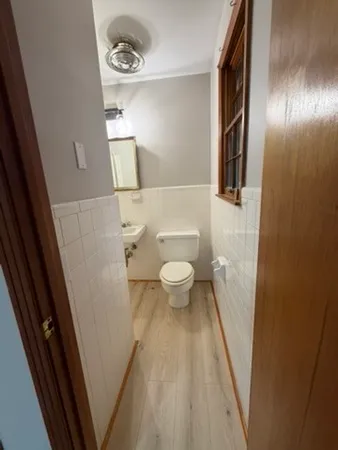 a bathroom with a toilet and a sink