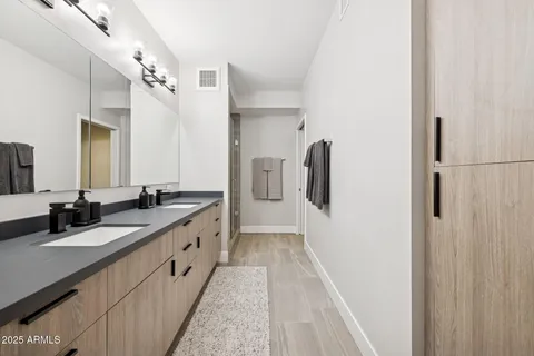 a view of a kitchen with fridge and sink