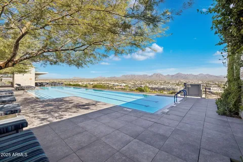 a view of a yard with swimming pool