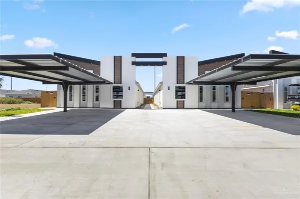 a view of large house with a yard