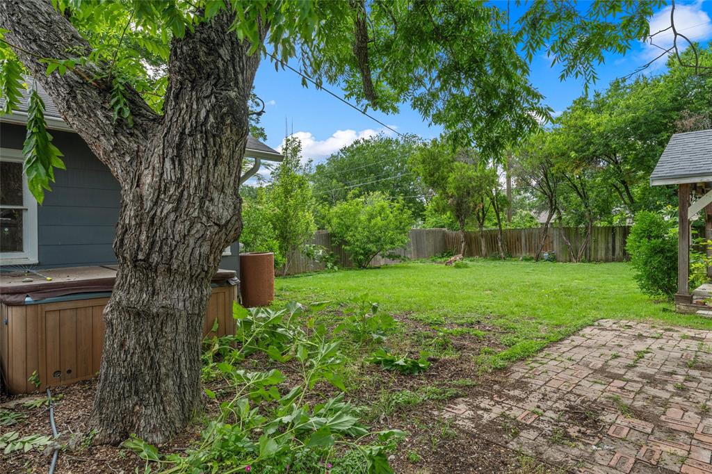 2717 Colcord Avenue Waco, TX 76707 - Photo 22 of 34 a view of a yard with a tree