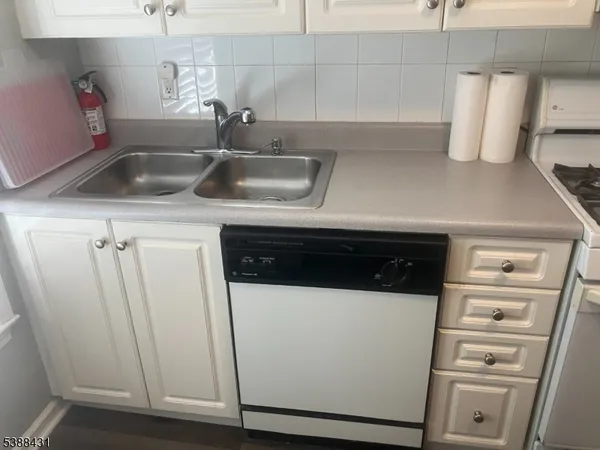 a kitchen with a stove and a refrigerator