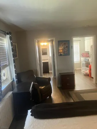 a bedroom with a bed and a mirror