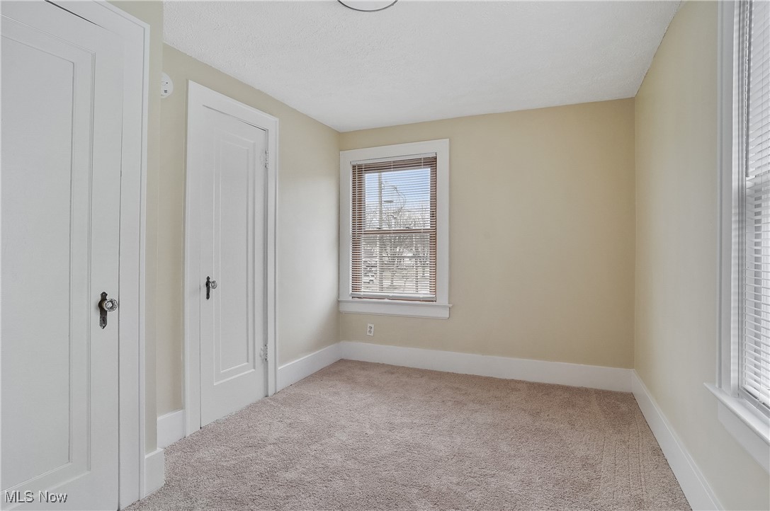 646 Brittain Road Akron, OH 44305 - Photo 26 of 36 Unfurnished bedroom with carpet and baseboards