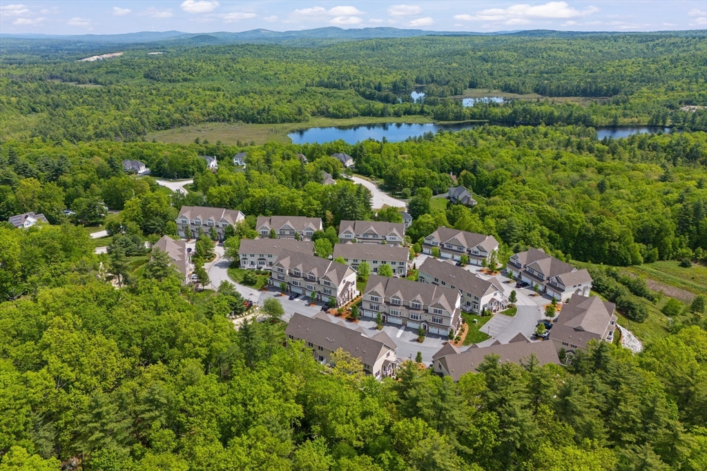 5D Manor Drive, Unit B Hooksett, NH 03106 - Photo 2 of 42 a view of a city with green field