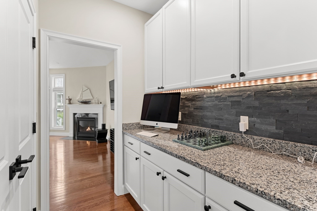 5D Manor Drive, Unit B Hooksett, NH 03106 - Photo 21 of 42 a bathroom with a granite countertop sink and a mirror