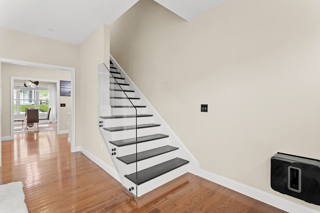 5D Manor Drive, Unit B Hooksett, NH 03106 - Photo 23 of 42 a view of a livingroom with wooden floor and stairs
