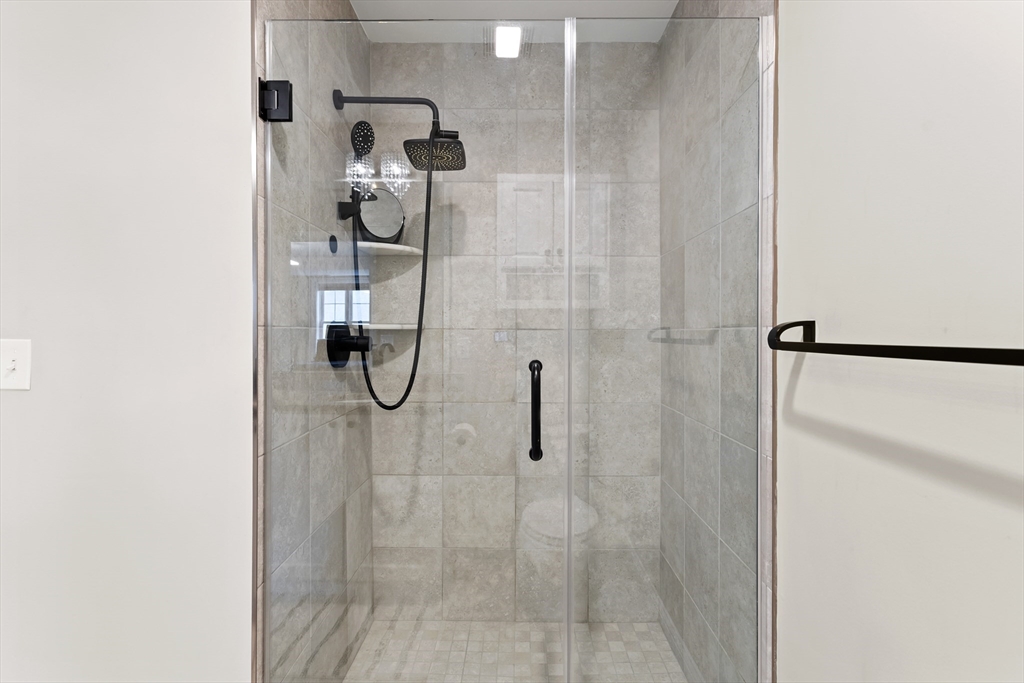 5D Manor Drive, Unit B Hooksett, NH 03106 - Photo 29 of 42 a bathroom with a shower