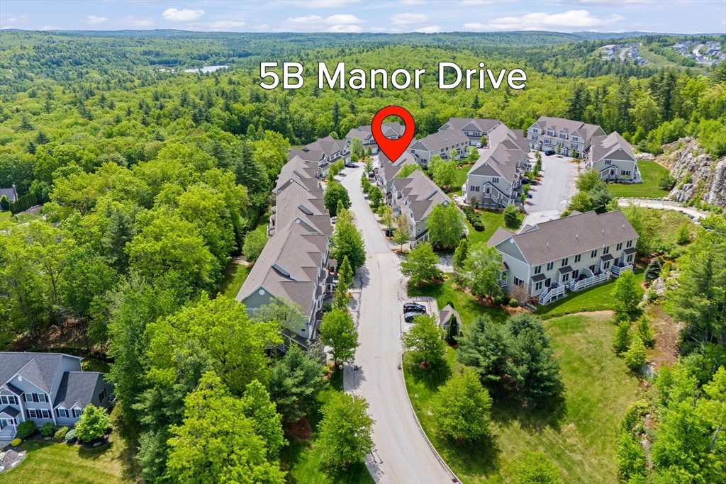 5D Manor Drive, Unit B Hooksett, NH 03106 - Photo 3 of 42 an aerial view of residential house with outdoor space and garden
