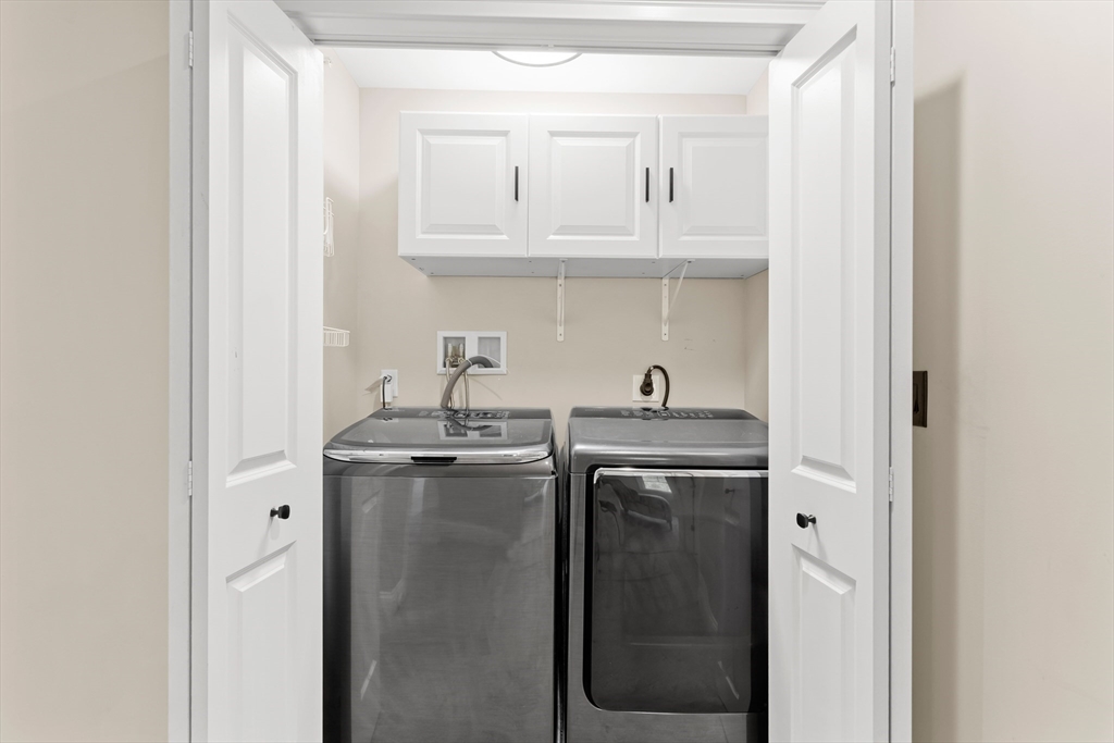 5D Manor Drive, Unit B Hooksett, NH 03106 - Photo 33 of 42 a kitchen with stainless steel appliances granite countertop a sink and cabinets