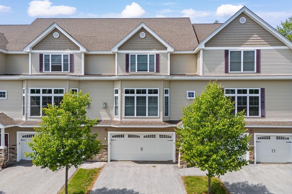 5D Manor Drive, Unit B Hooksett, NH 03106 - Photo 4 of 42 front view of a house with a yard