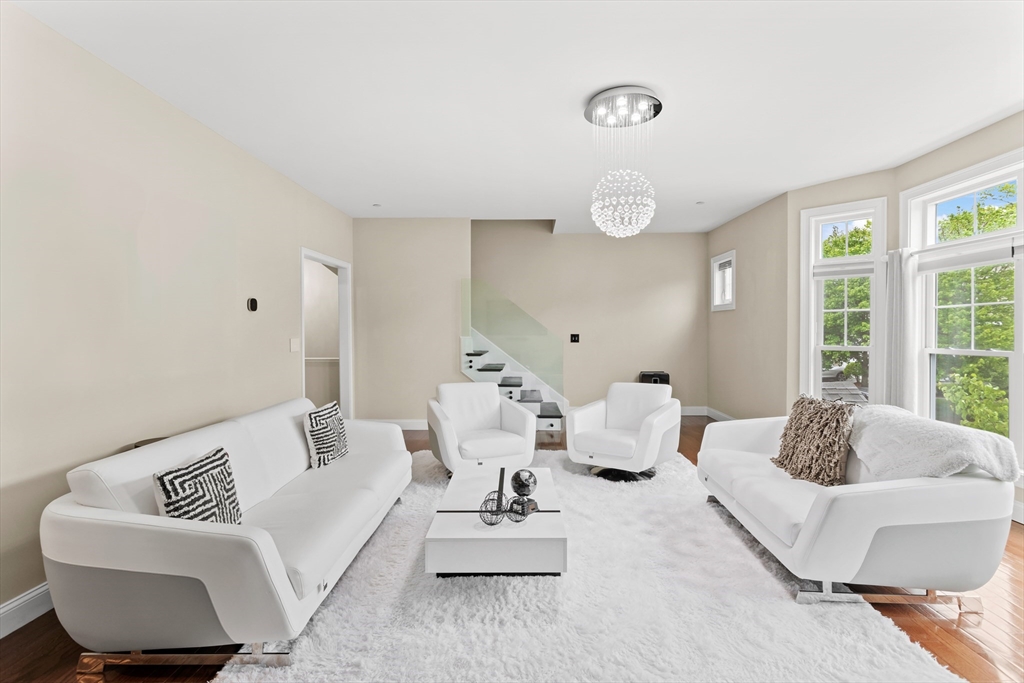 5D Manor Drive, Unit B Hooksett, NH 03106 - Photo 9 of 42 a living room with furniture and a large window