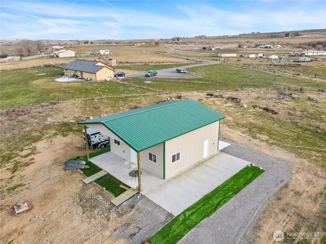 an aerial view of a house with a ocean view