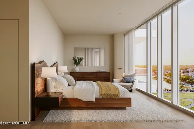 a living room with furniture and large windows