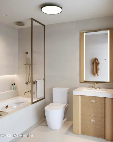 a bathroom with a sink a toilet and a bathtub