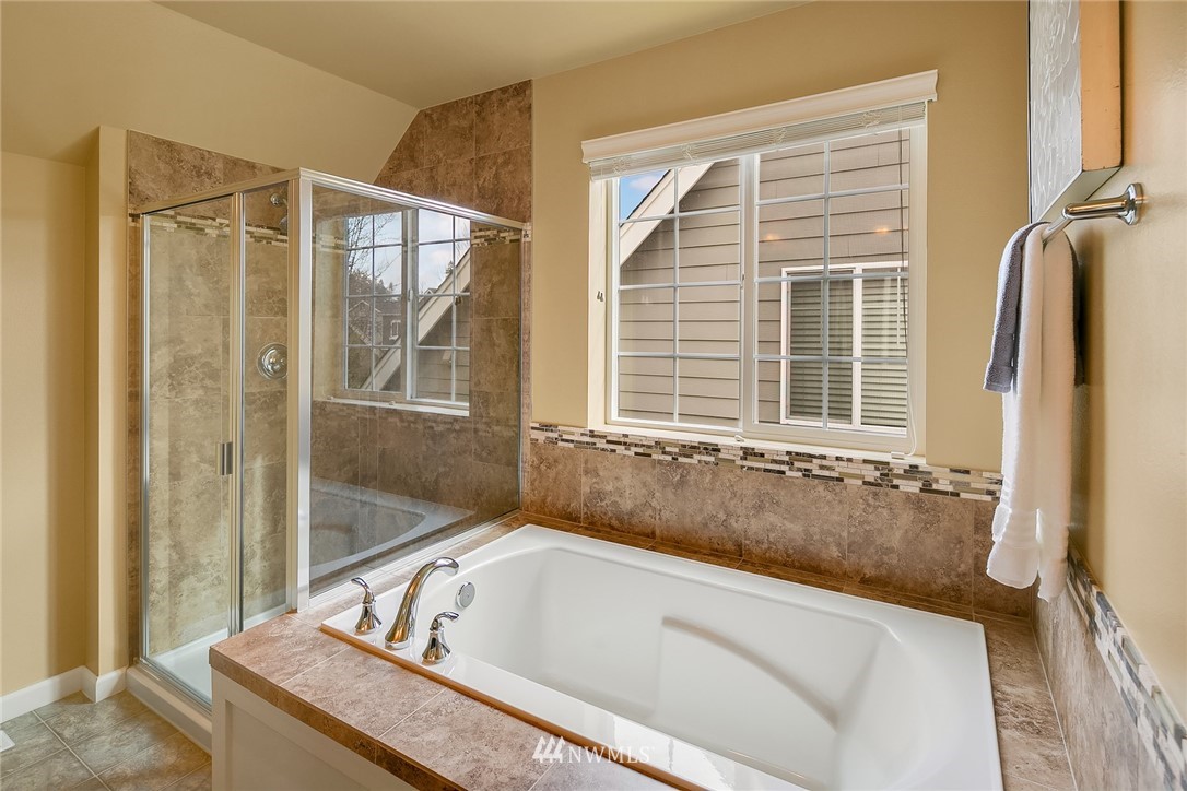 3807 219th Street Southeast Bothell, WA 98021 - Photo 17 of 23 a bath tub sitting next to a window