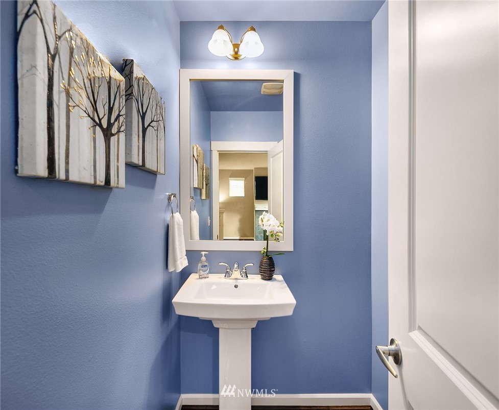 3807 219th Street Southeast Bothell, WA 98021 - Photo 10 of 23 a bathroom with a sink a mirror and a bathtub
