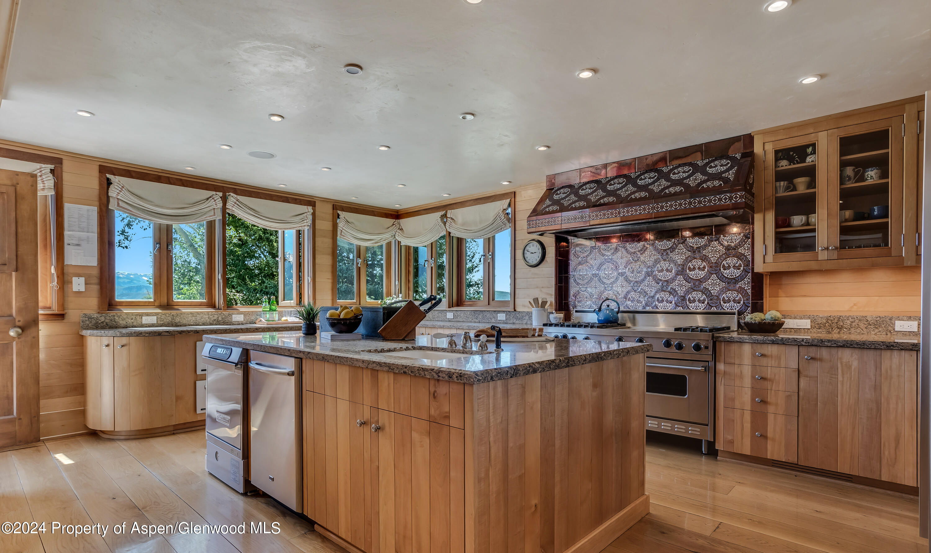 1200 Kessler Drive Aspen, CO 81612 - Photo 18 of 58 a kitchen with stainless steel appliances granite countertop a stove and a sink